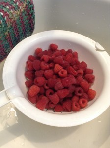 Fresh red raspberries....and one of my homemade crocheted wash cloths, LOL